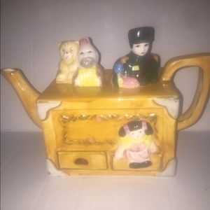 Vintage Tea Pot it depicts a Toy Box